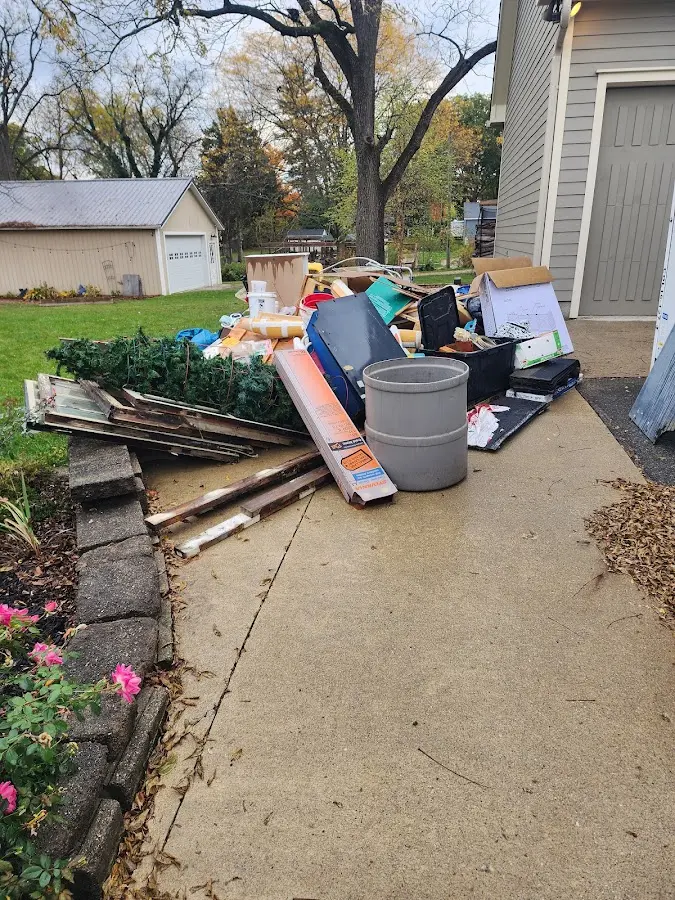 Dumpster being loaded with debris for Estate Cleanout Dumpster Rental in York
